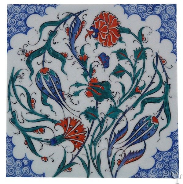 a blue and white tile with red flowers on the bottom, surrounded by swirls