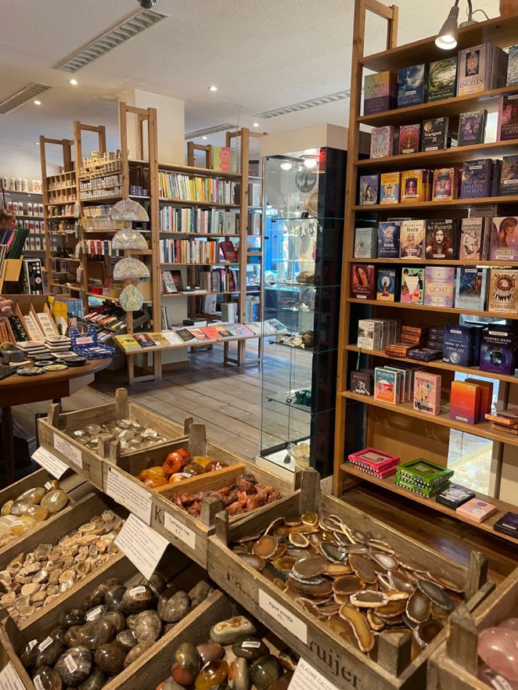 the inside of a book store filled with lots of books and collectibles on shelves