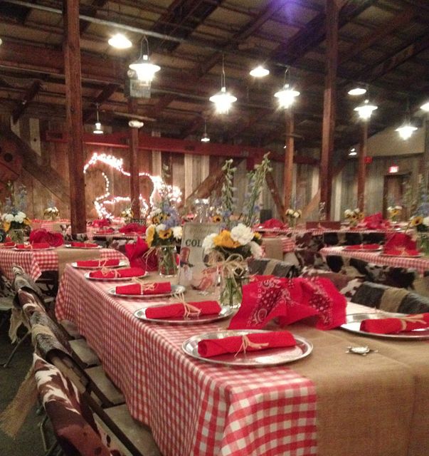 the tables are set with red and white checkered cloths