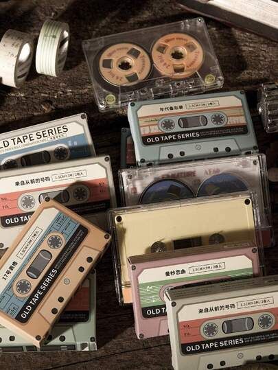 an assortment of old - fashioned tapes and tape recorders