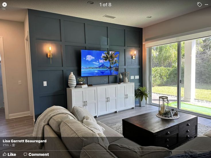 the living room is clean and ready to be used as a tv screen for entertainment