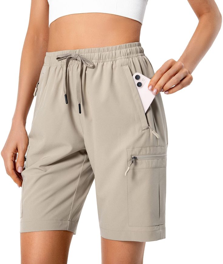 PRICES MAY VARY. Lightweight & Quick Dry Fabric: Lightweight, breathable, quick-dry and water-resistant fabric. The womens hiking shorts keep you cool and fresh all day. Adjustable Elastic Waistband: The women cargo shorts have a 360-degree elastic waist with adjustable drawstring to prevent pressure marks on the tummy and offers a custom fit during hiking or athletic. 5 Zipper Pockets: 2 Zipper side pockets, 2 zipper cargo pockets and 1 zipper rear pocket are deep enough to store your cellphone Pull On Shorts, Hiking Shorts, Hiking Women, Women Cargos, Water Resistant Fabric, Camping Trips, Moisture Wicking Fabric, Athletic Shorts, Custom Fit