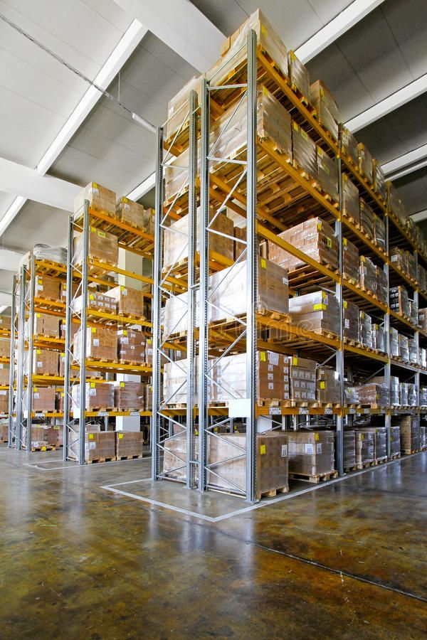 a large warehouse filled with lots of boxes and pallet racked to the ceiling