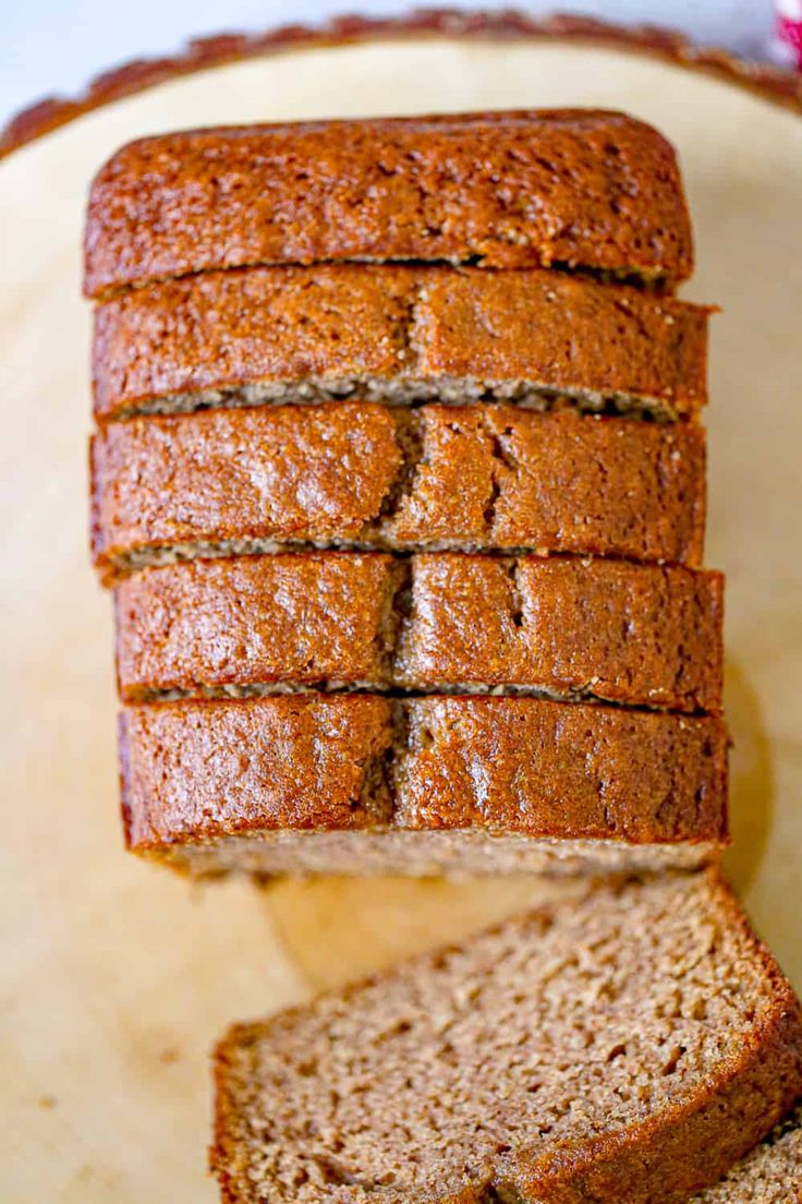 sliced loaf of banana bread sitting on top of a cutting board