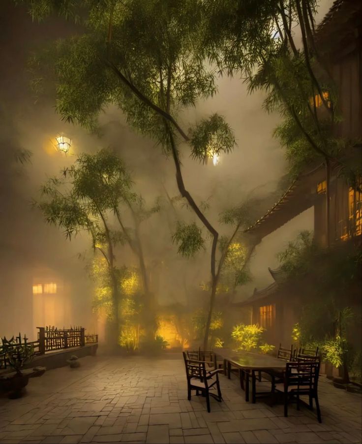 foggy courtyard with benches and tables in the foreground, lit by street lamps