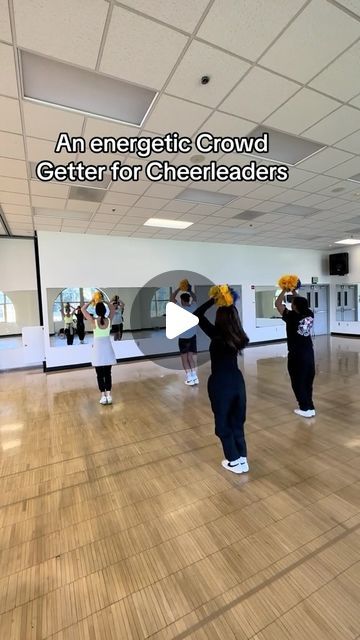 an energetic crowd is getting for cheerleaders in the dance studio with their hands up