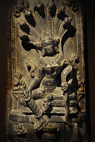 an intricately carved statue on display in a museum