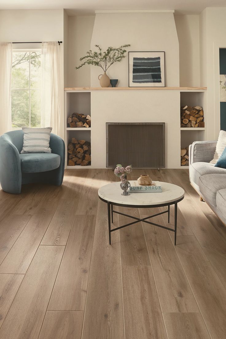 a living room filled with furniture and a fire place