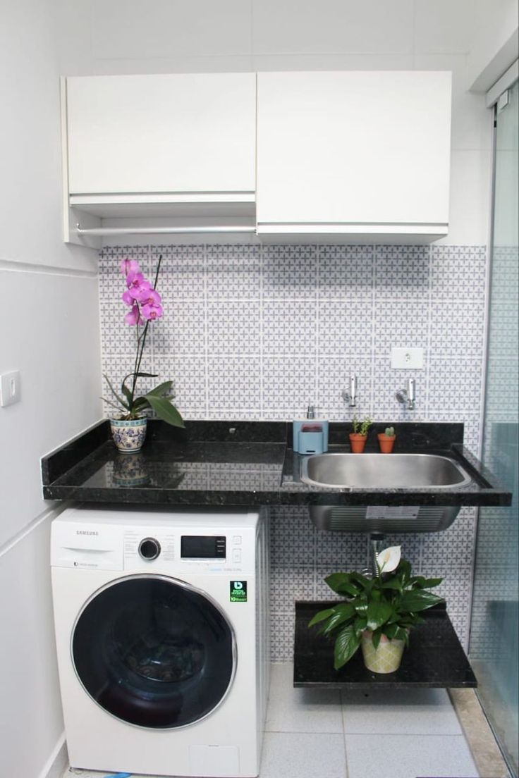 a washer and dryer in a small kitchen