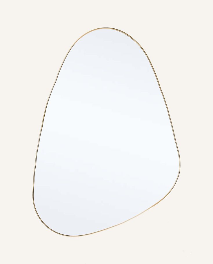 a white mirror with gold trim on the edge and an oval shape in the middle