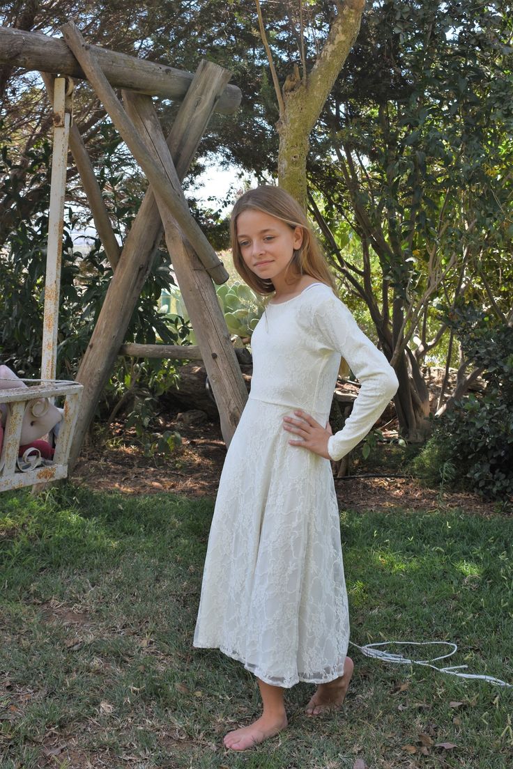 Girls ivory lace dress, fine and unique! Made from the finest fabrics, your young lady will love it!. Two layers of soft lace and soft cotton fabrics. Nice, twirly and special! Made of lace with a 100% cotton linen. Sizes 2 for 2 years old 4 for 3 years old 6 for 4/5 years old 8 for 5/6 years old 10 for 7/8 years old 12 for 9/10 years old 14 for 11/12 years old See more dresses in my shop: https://www.etsy.com/shop/Coloresbabyandgirls?section_id=16739178&ref=shopsection_leftnav_1 Back to my shop: https://www.etsy.com/shop/Coloresbabyandgirls?ref=hdr_shop_menu Thank you for stopping by ♥ Fitted Lace Dress With Lace Sleeves For Dress-up, Long Sleeve Delicate Lace Party Dress, Long Sleeve Lace Dress With Fitted Bodice, Lace Dress With Long Sleeves And Fitted Bodice, Spring Confirmation Lace Dress, Fitted Princess Dress With Lace Bodice For Confirmation, Spring Dresses With Delicate Lace And Long Sleeves, Scalloped Lace Long Sleeve Dress, Elegant Long Sleeve Princess Dress For First Communion