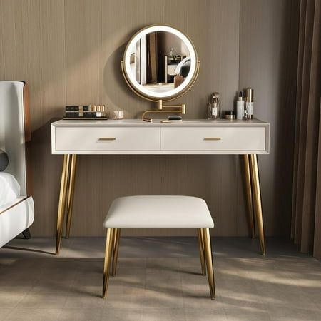 a bedroom with a vanity, stool and mirror