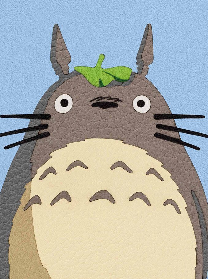 a drawing of a totoro with a green leaf on its head