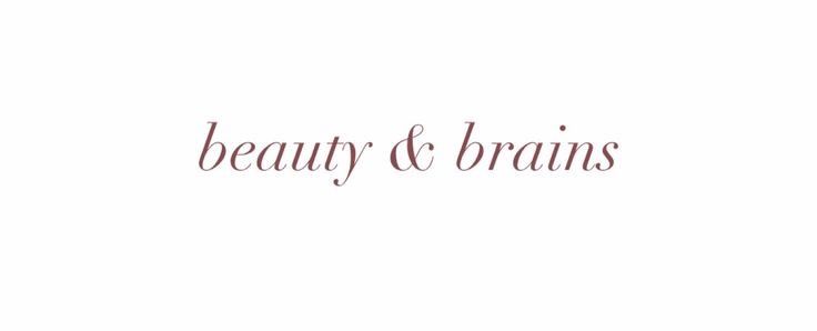 the word beauty and brains written in red ink