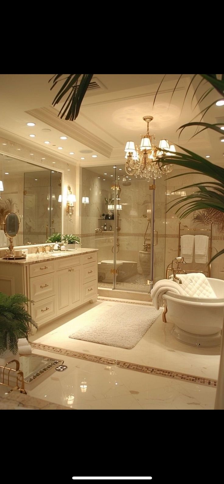 a large bathroom with a tub, sink and chandelier in the middle of it