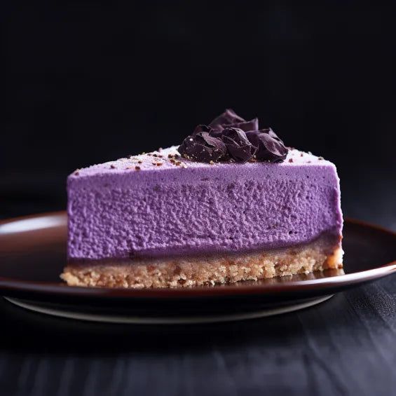 a slice of purple cheesecake on a plate