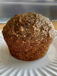 a close up of a muffin on a plate