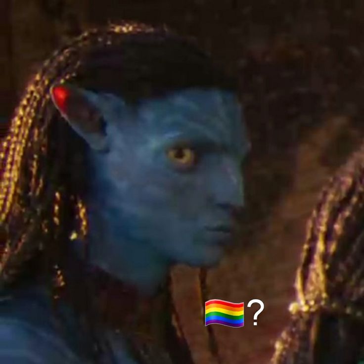 a man with long hair and blue skin is looking at something in front of him