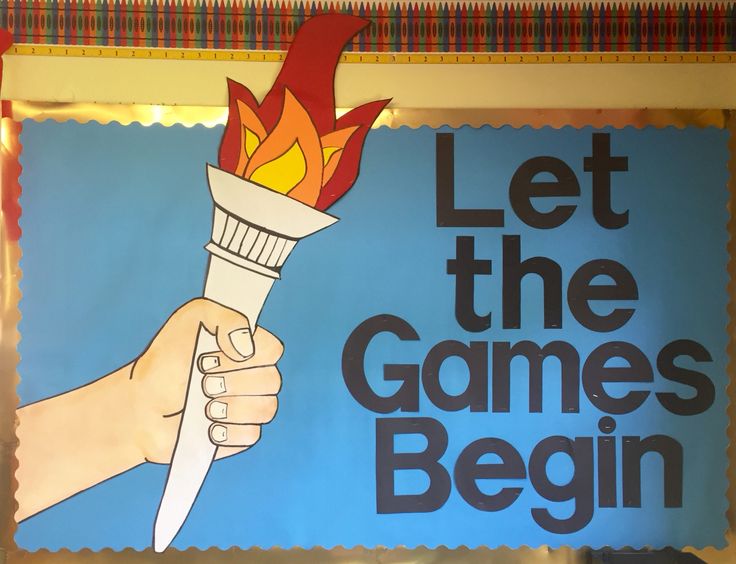 a sign that says let the games begin with a hand holding a burning matchstick