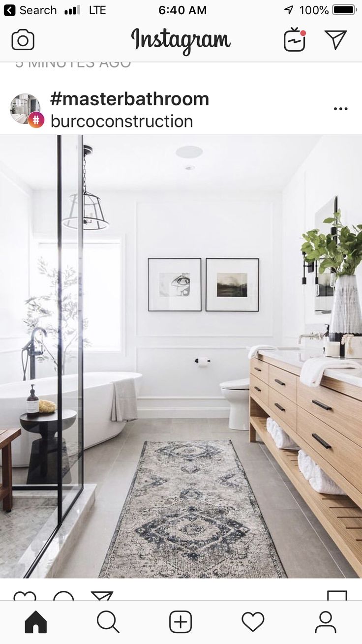 a bathroom with a large rug on the floor