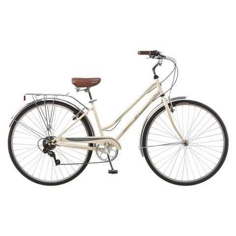 a white bicycle with brown seat and handlebars on the front wheel, against a white background