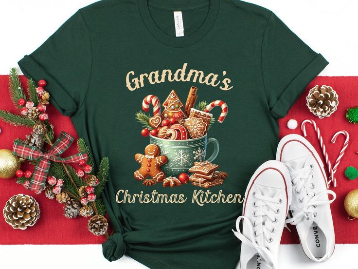 Grandma's Christmas Shirt, Gingerbread Cookie Tee, Holiday Baking T-Shirt, Grandma's Kitchen Apparel, Grandma Christmas Gift, Festive Top Bella + Canvas Premium Soft Tshirt Indulge in the timeless appeal of this classic unisex jersey short sleeve tee, designed to feel like a well-loved favorite. Crafted from soft cotton and featuring a quality print, this shirt is destined to become your go-to wardrobe staple. The ribbed knit collar enhances shaping, while taped shoulders ensure a better fit ove Nana Christmas Gifts, Cookie Shirt, Gingerbread Latte, Grandma's Kitchen, Grandmas Christmas, Christmas Gifts For Grandma, Gingerbread Cookie, Christmas Graphic, Cute Christmas Gifts