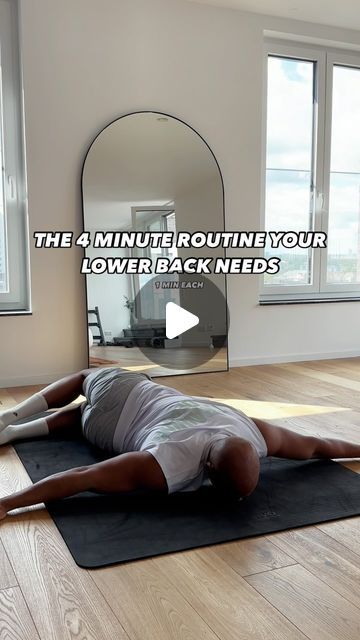 a man laying on top of a yoga mat in front of a mirror with the words, the 4 minute routine your lower back needs