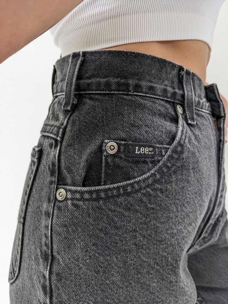 Classic vintage Lee jeans in a perfectly faded black cotton. Jeans have a high rise / tapered leg fit, belt loops along the waist, a 5-pocket design and a back waist logo patch. A lovely pair of everyday denim to wear with our James Cotton Mock Neck Sweatshirt in either heather grey or matching faded black. Pair with a cozy puffer jacket & lace-up sneakers. Tag reads Lee Classic Washed Black Jeans With Belt Loops, High Rise Gray Jeans With Belt Loops, Washed Black High Waist Jeans With Five Pockets, High Waist Washed Black Jeans With Five Pockets, High Waist Washed Black Jeans, Washed Black Straight Leg Jeans With Belt Loops, Vintage Washed Black Jeans With Pockets, Classic High Waist Washed Black Bottoms, Gray Denim Jeans With Belt Loops