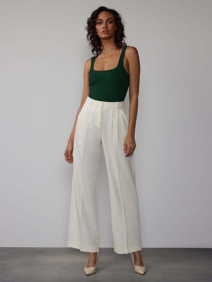 These Curvy Wide Leg Pleated Pants offer a high-rise fit with pleated detailing, perfect for a formal and flattering look. The wide-leg design and curvy fit provide a comfortable and stylish option for both formal and casual looks. Chic Pleated Ankle-length Wide Leg Pants, Chic Pleated Wide Leg Pants, Elegant High Waist Pleated Pants, Elegant High-waist Pleated Pants, Elegant Solid Wide Leg Pleated Pants, Elegant Pleated Wide Leg Pants For Summer, Chic Fitted Wide Leg Pants With Pressed Crease, Chic Wide Leg Dress Pants For Business Casual, Formal High Waist Pleated Wide Leg Pants