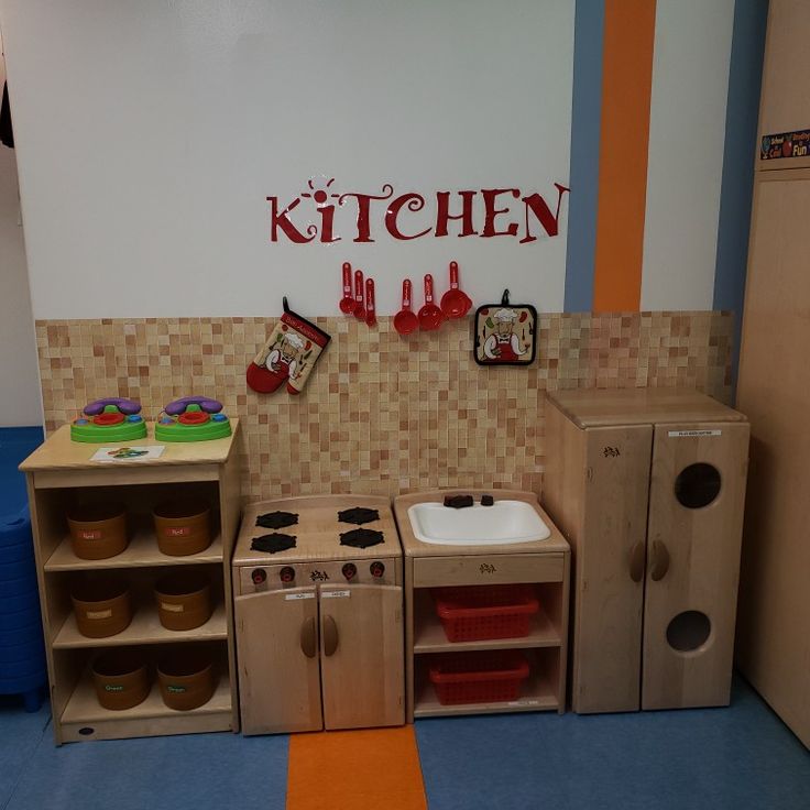 a play kitchen with lots of wooden toys