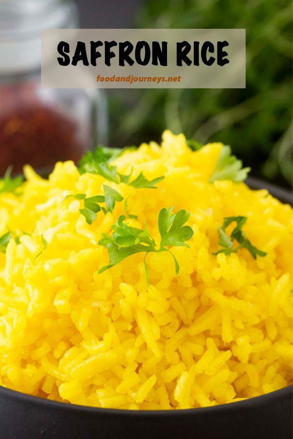 saffron rice in a black bowl with parsley on top and the words saffron rice above it