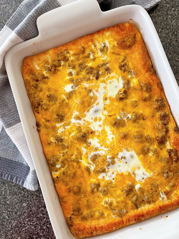 a casserole dish with meat and cheese in it