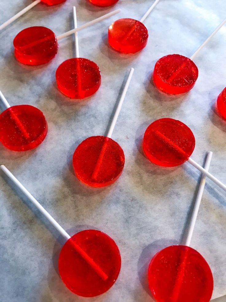 red lollipops sitting on top of a table