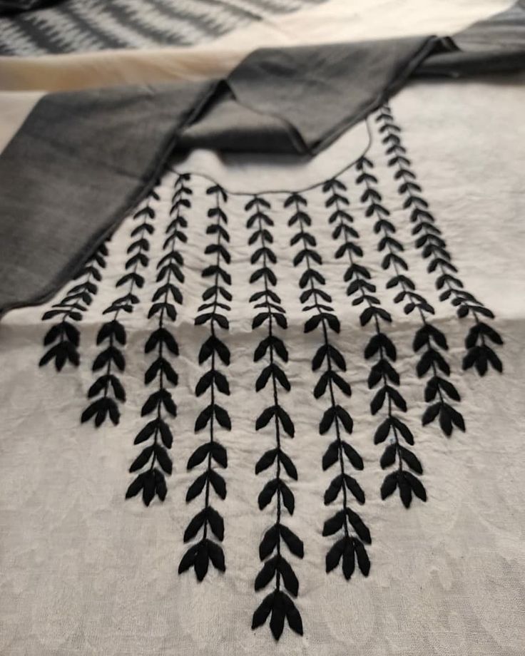 black and white fabric with leaves on it