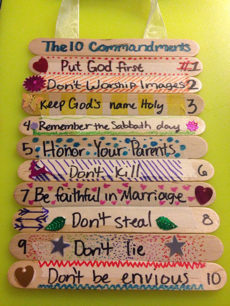 the ten commandments for god's love are hanging on a green wall in front of a door