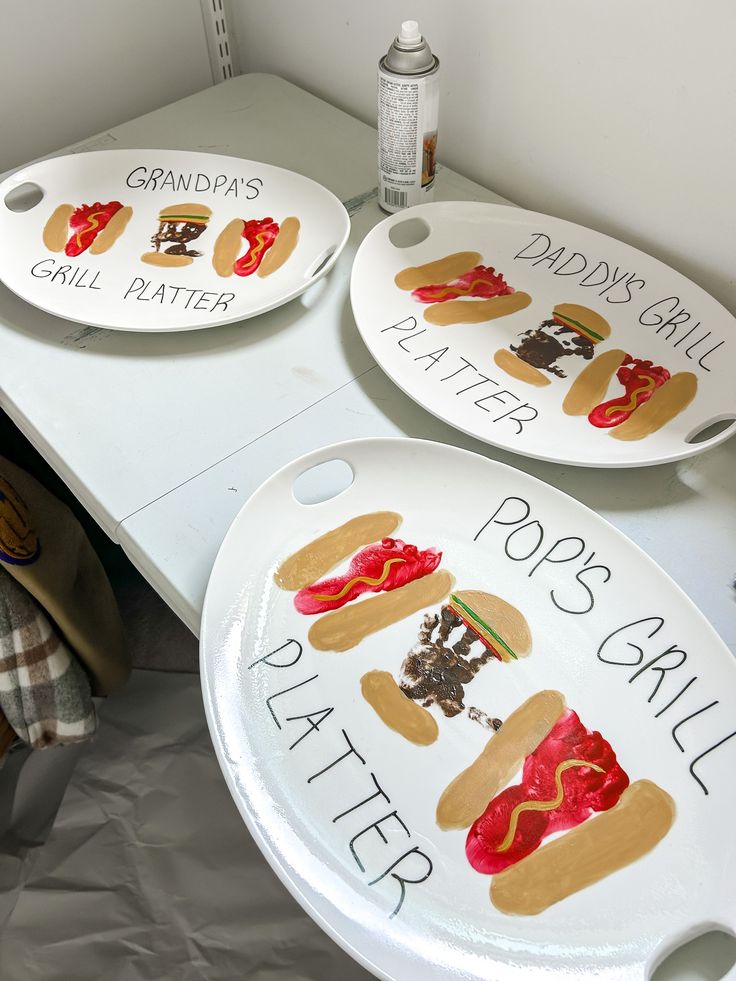 three plates with different types of food on them sitting on a table next to a teddy bear