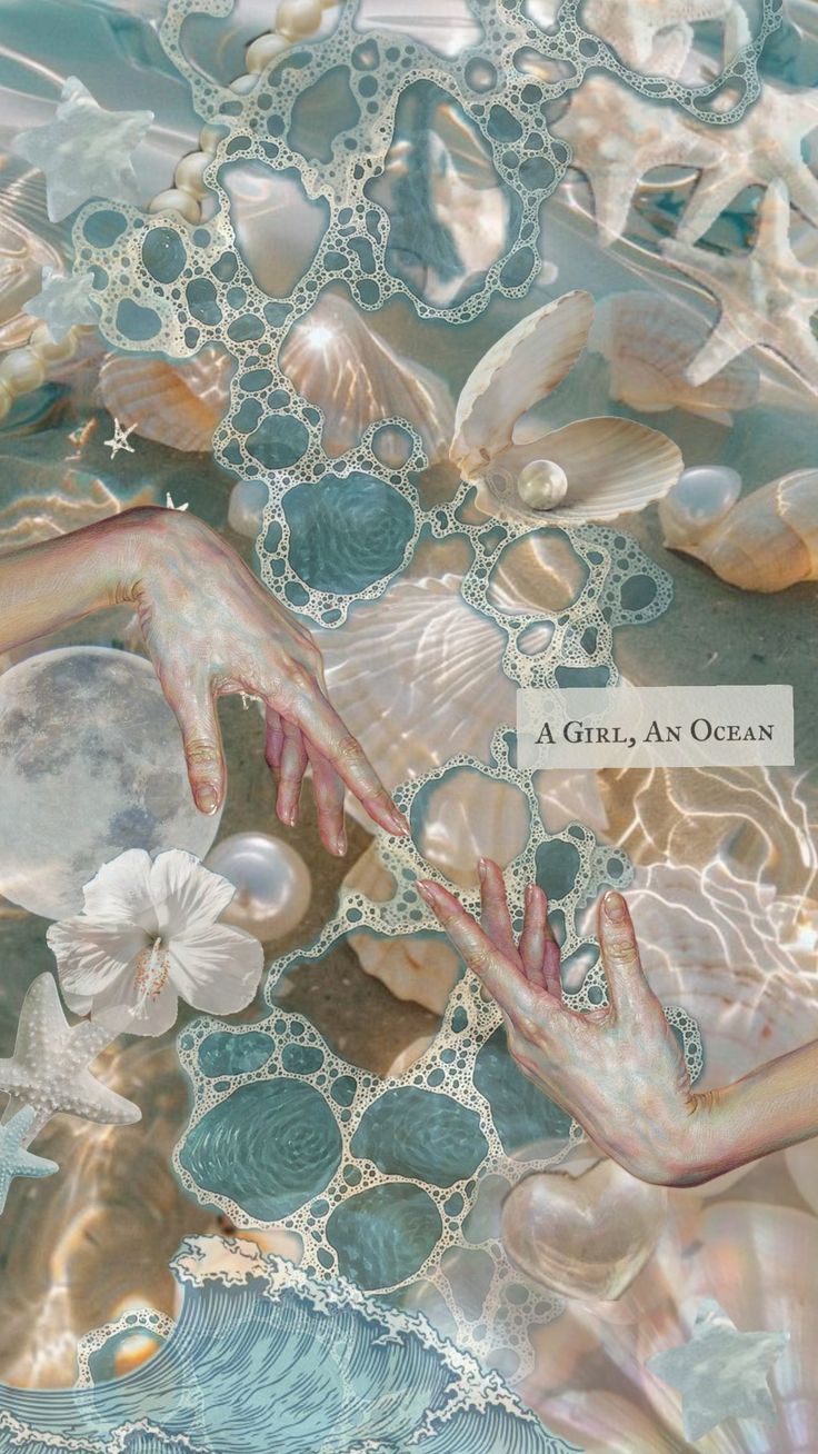 an image of the ocean with shells and pearls