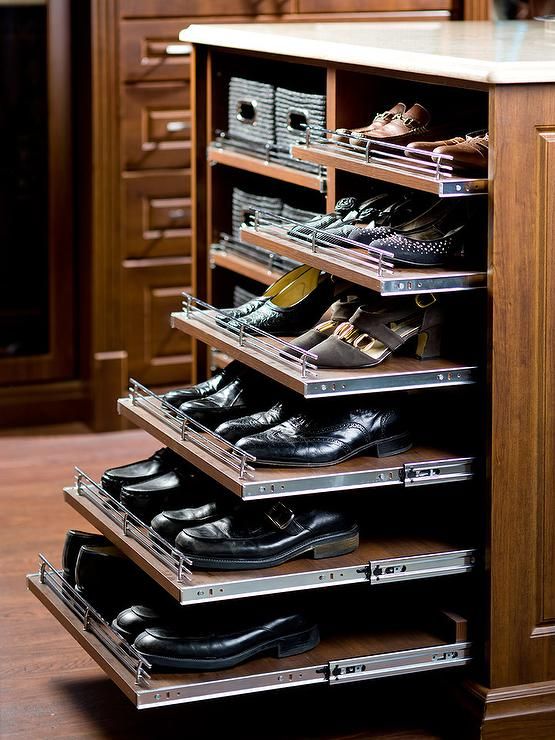 an organized shoe rack in a closet