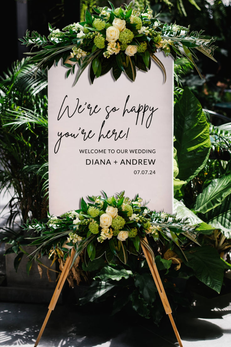 a sign that says, we're so happy you're here welcome to your wedding dana and andrew