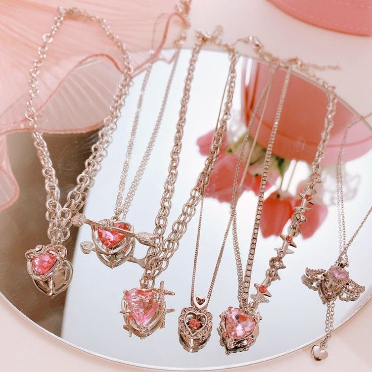 Be the envy of all your friends with this exquisite Y2K Pink Crystal Peach Heart Necklace. Masterfully crafted with opulent tones of pink crystals, this chic necklace features a luxuriant heart pendant design that will add undeniable elegance to your look. Perfect for formal events or everyday wear, this piece is sure to impress. Pink Kawaii Jewelry For Valentine's Day, Kawaii Pink Jewelry For Valentine's Day, Pink Heart-shaped Kawaii Jewelry, Pink Kawaii Heart-shaped Jewelry, Pink Heart Charm Necklace For Party, Pink Heart-shaped Charm Necklace For Party, Sweet Pink Jewelry With Heart Beads, Pink Heart Beads Necklace For Valentine's Day, Cute Heart Necklace For Party