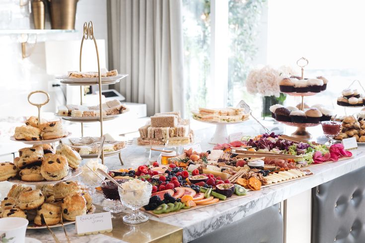 an assortment of desserts and pastries on a table