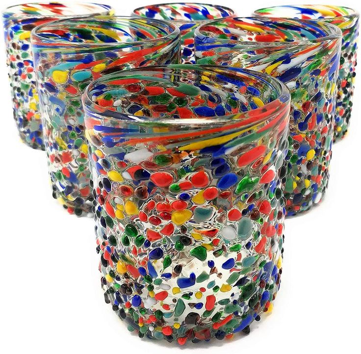 multicolored glass tumblers are lined up together