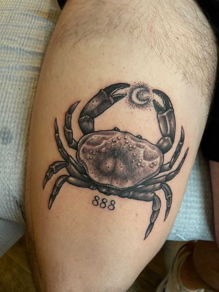 a man with a crab tattoo on his leg