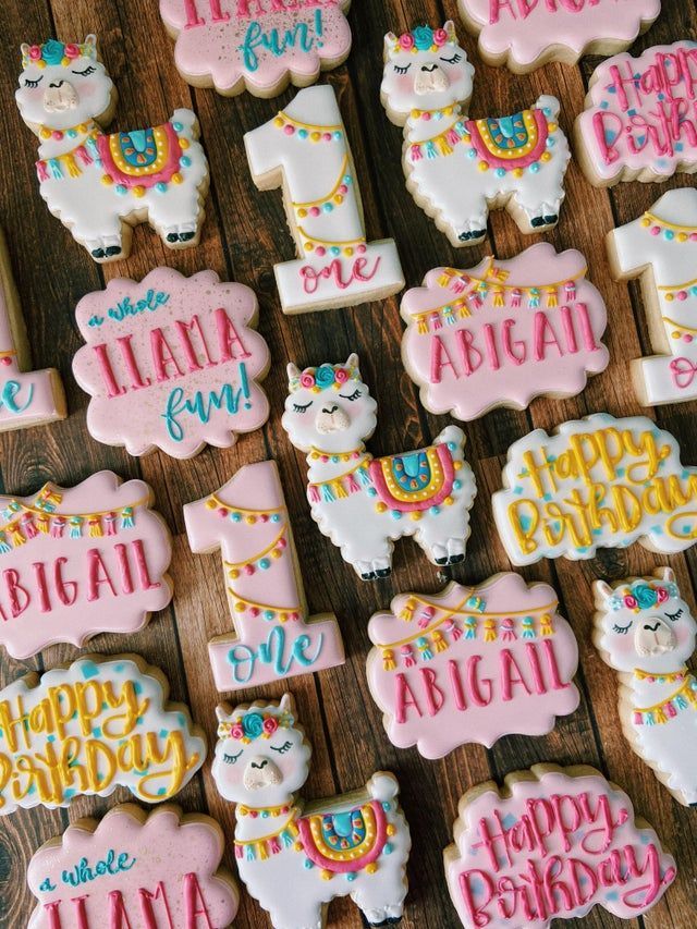 decorated alpaca cookies with happy birthday written on them