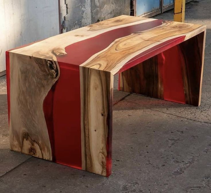 a bench made out of wood and red paint