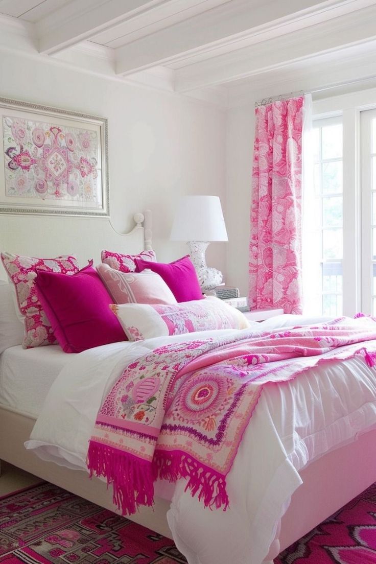 a bedroom with pink and white bedding, curtains and rugs on the floor