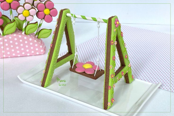 a small wooden swing with flowers in the back and pink polka dot vase on top