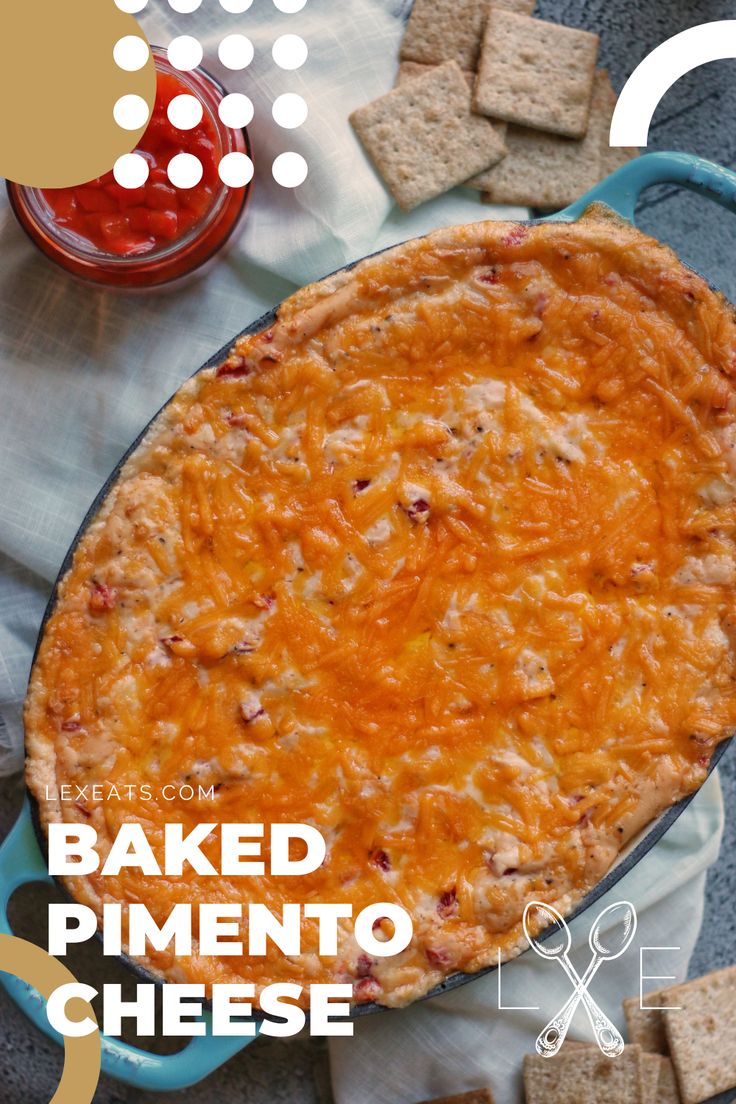 baked pimentoo cheese in a blue dish next to crackers