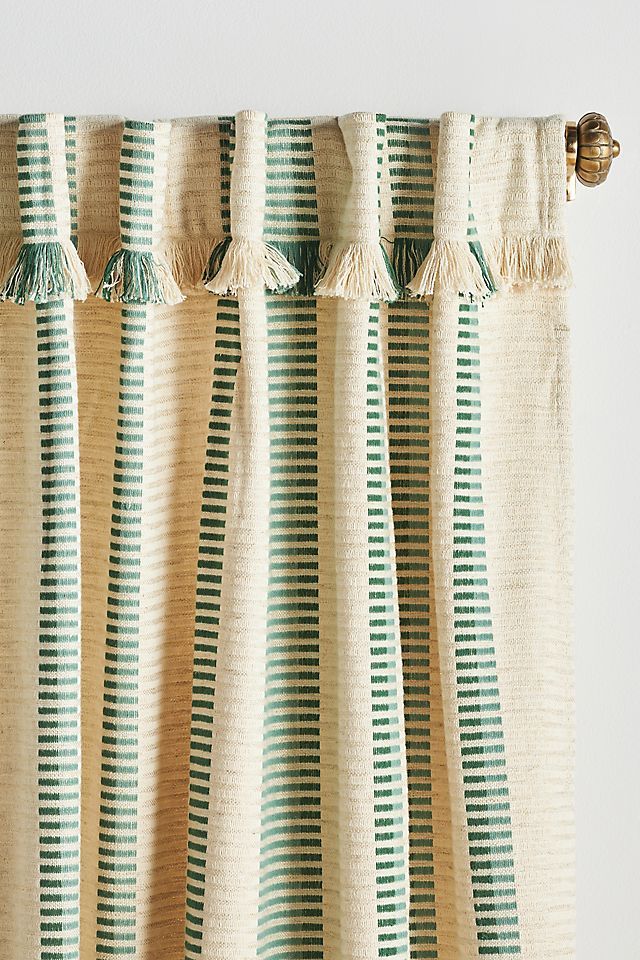 a curtain with green and white stripes on it