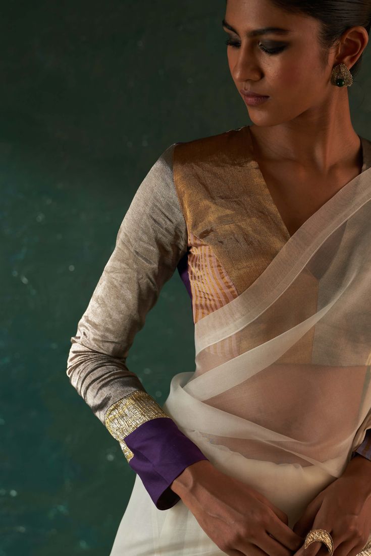 From festive to wedding, our gota sari that makes you stand out from the rest, paired with a multi tissue patchwork long sleeve blouse that adds a touch of glamour. This contemporary sari has the feel of the old world charm that is perfectly blending with the modern style. Gold tissue blazer over it not only gives a fusion contemporary touch but also keeps you warm yet glam. Tussar Silk Blouse Piece For Party, White Cotton Silk Festive Sets, Party Cotton Silk Choli With Sheer Dupatta, Festive White Cotton Silk Set, Designer Cotton Silk Blouse With Gota Work, Cotton Silk Pre-draped Saree With Zari Work For Celebration, Celebration Cotton Silk Saree With Zari Work, Festive Cotton Silk Choli With Sheer Dupatta, Festive Cotton Silk Blouse With Dupatta